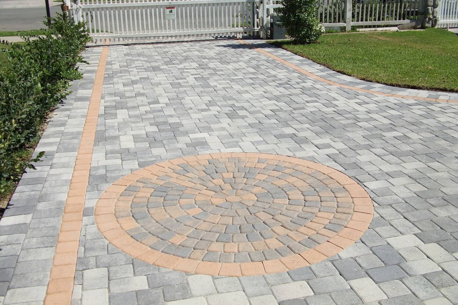 a brick driveway with a circular design
