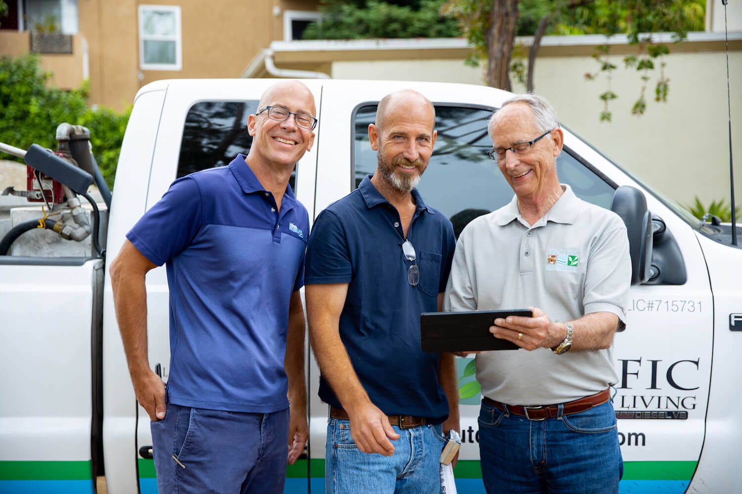 a group of men standing in front of a van